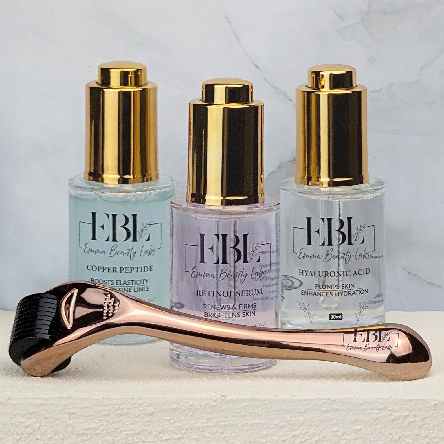 Three serum bundle with a microneedle dermaroller. There is Copper Peptide serum, retinol serum and hyaluronic Acid serum.