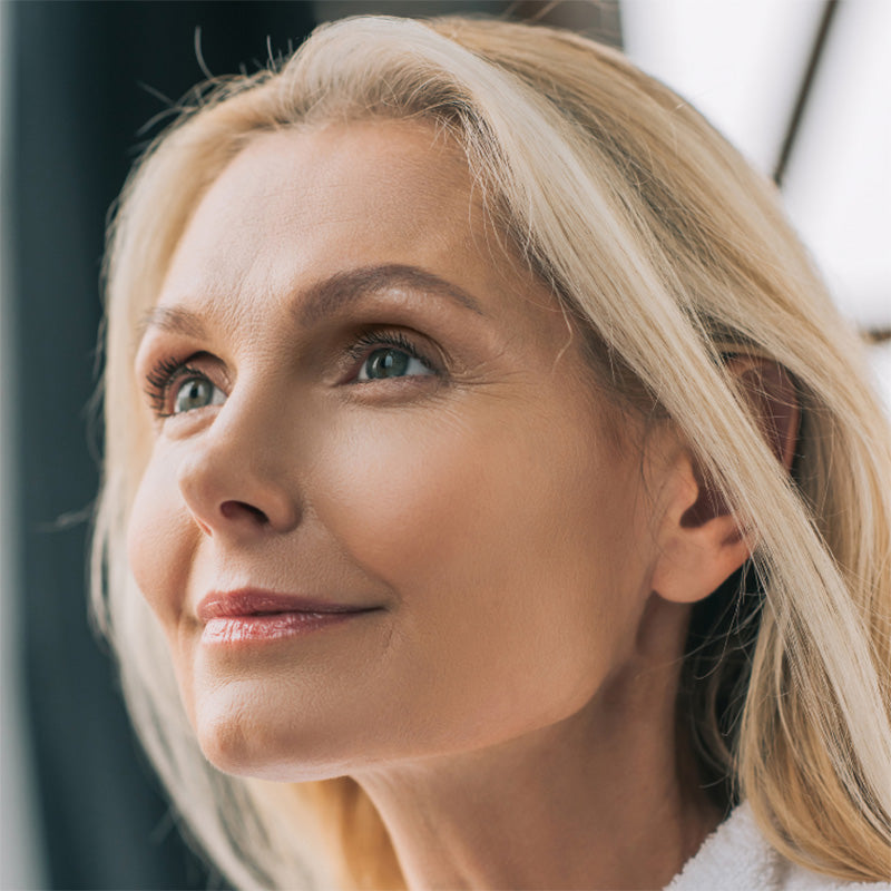 Beautiful mature woman after using retinol